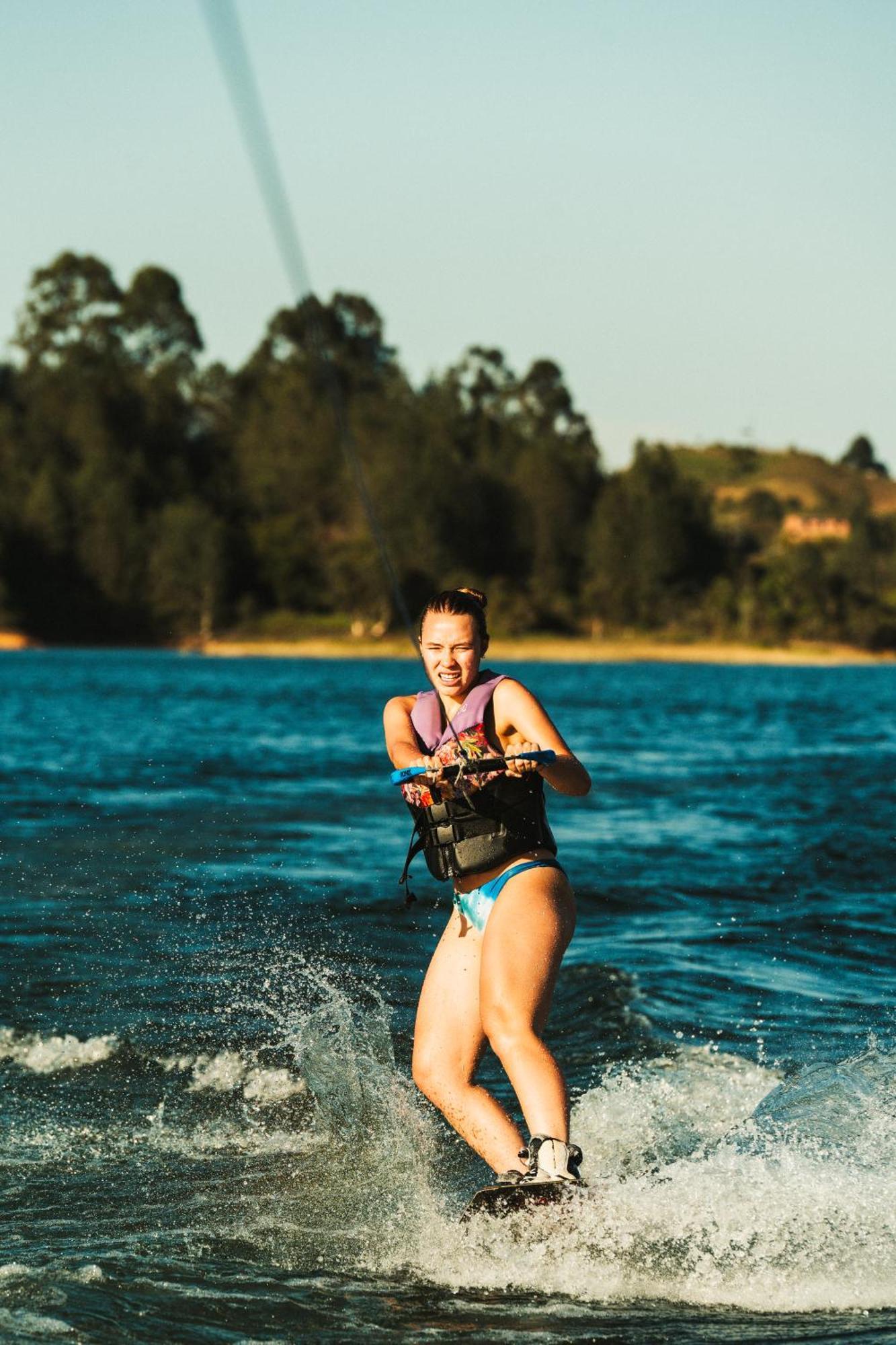 The Boato Hotel Guatape Exterior photo A woman waterskiing