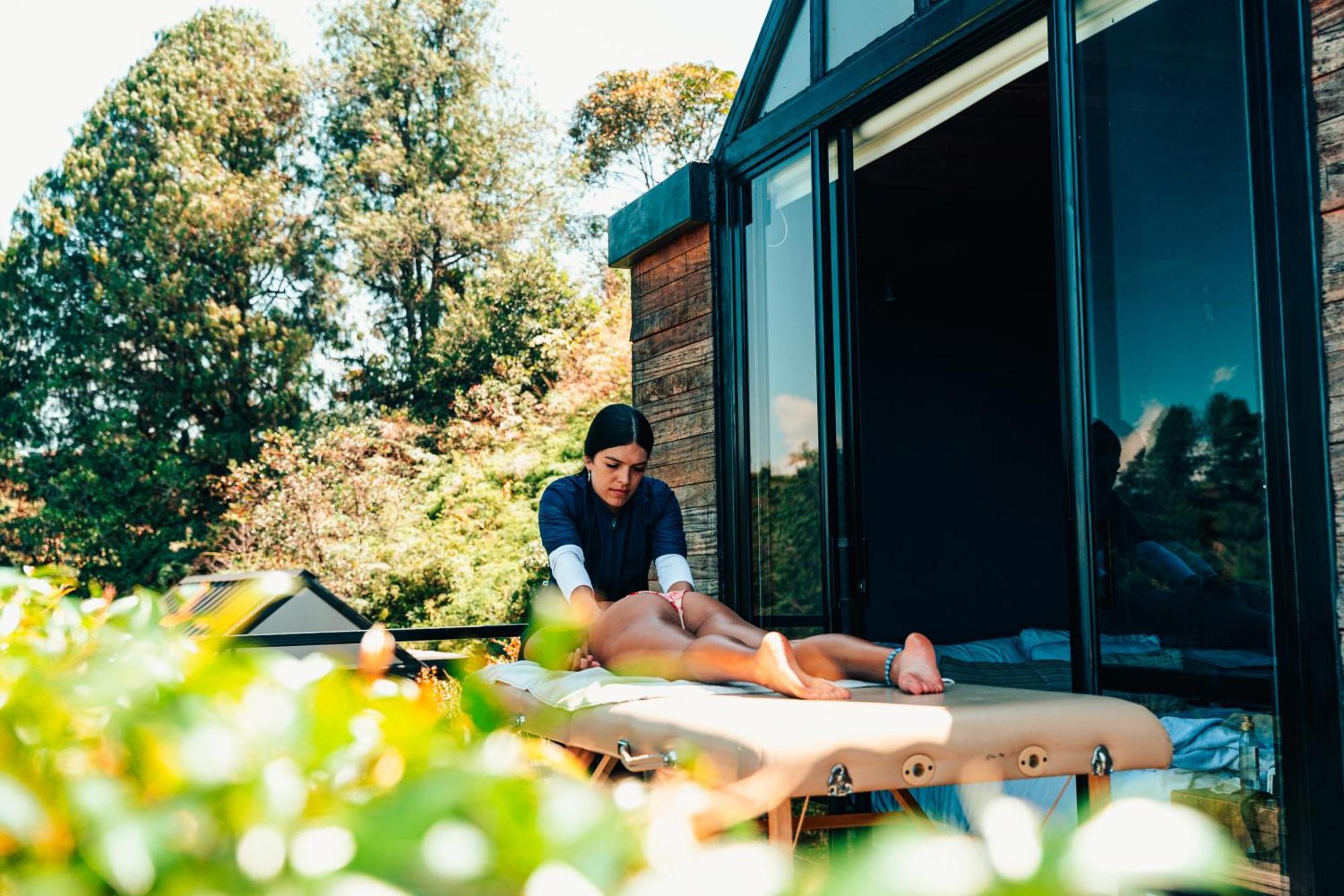 The Boato Hotel Guatape Exterior photo A massage therapist treating a client