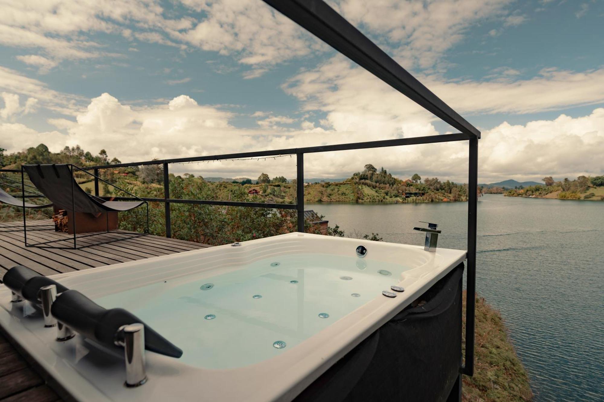 The Boato Hotel Guatape Exterior photo A hot tub with a lake view