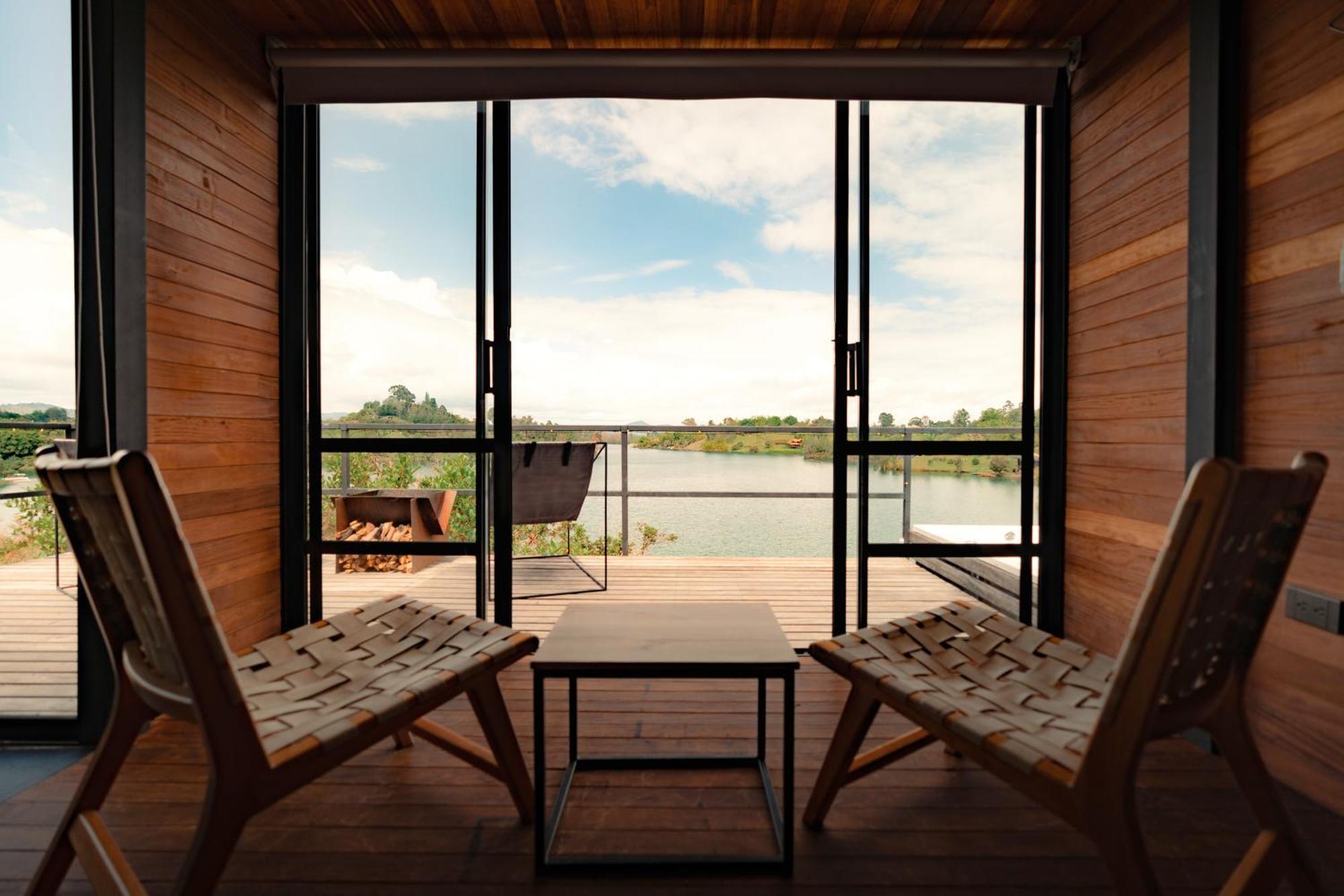 The Boato Hotel Guatape Exterior photo View from the interior of a floating cabin